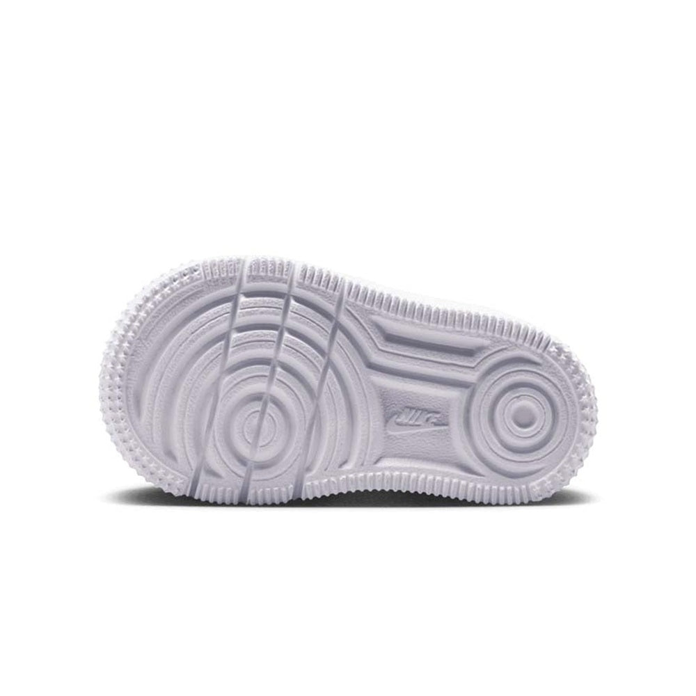 Toddler Nike Air Force 1 low-top sneakers, white outsole tread close-up.