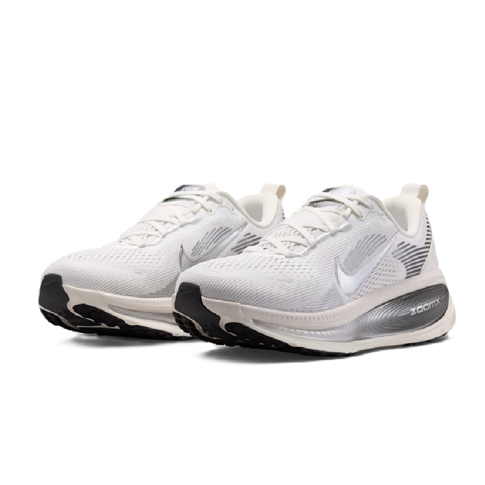 White Nike Vomero 18 lace-up running shoes with textured knit upper and black heel accents