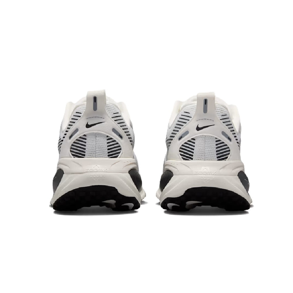 White Nike Vomero 18 rear view lace-up runners with pull tab and striped heel panels