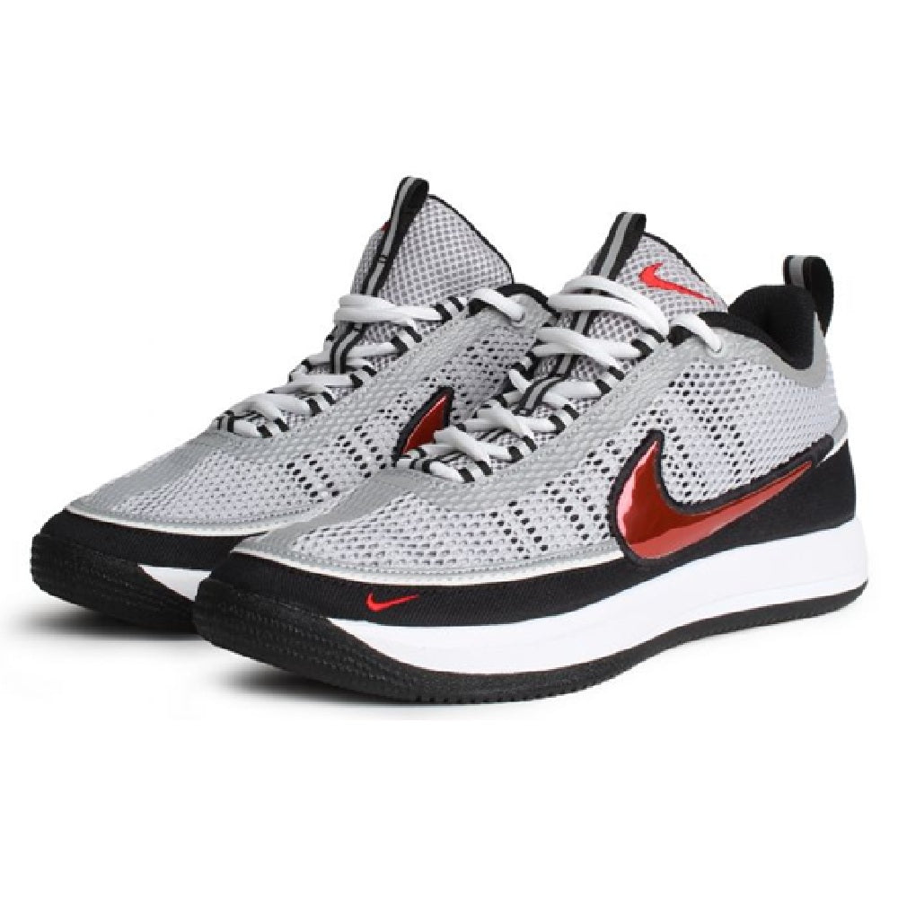 Pair of silver knit low-top sneakers with red Nike swoosh and black outsoles