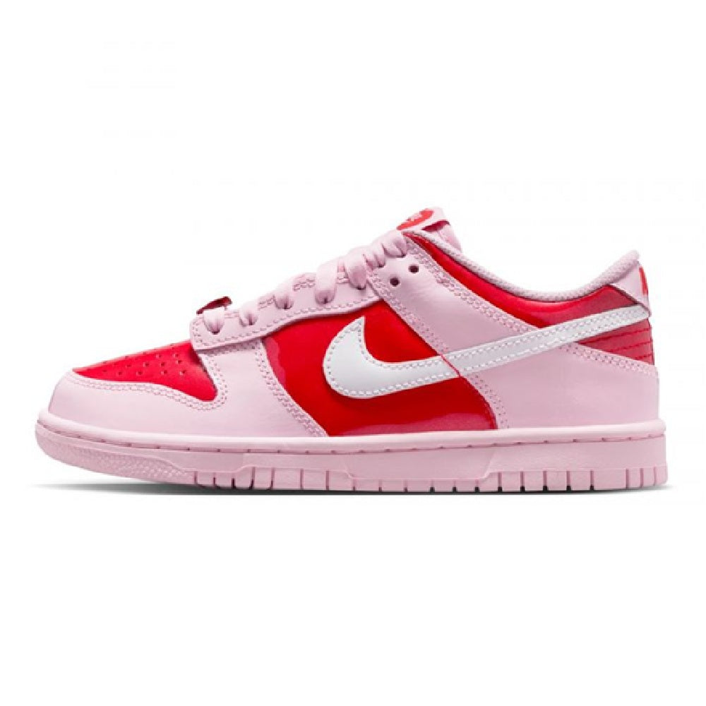 Pink and red low-top sneakers with white swoosh, lace-up front, and pink rubber sole.