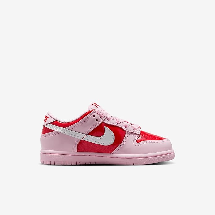 Kids low-top sneakers in pink leather with white swoosh and red toe and side panels