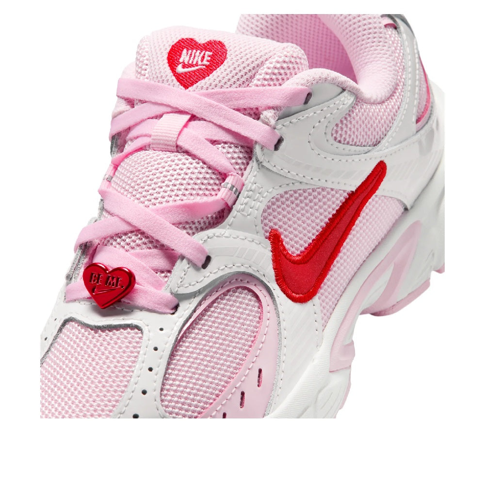 Kids' Nike V5 RNR sneakers close-up, pink laces with red Nike tongue badge