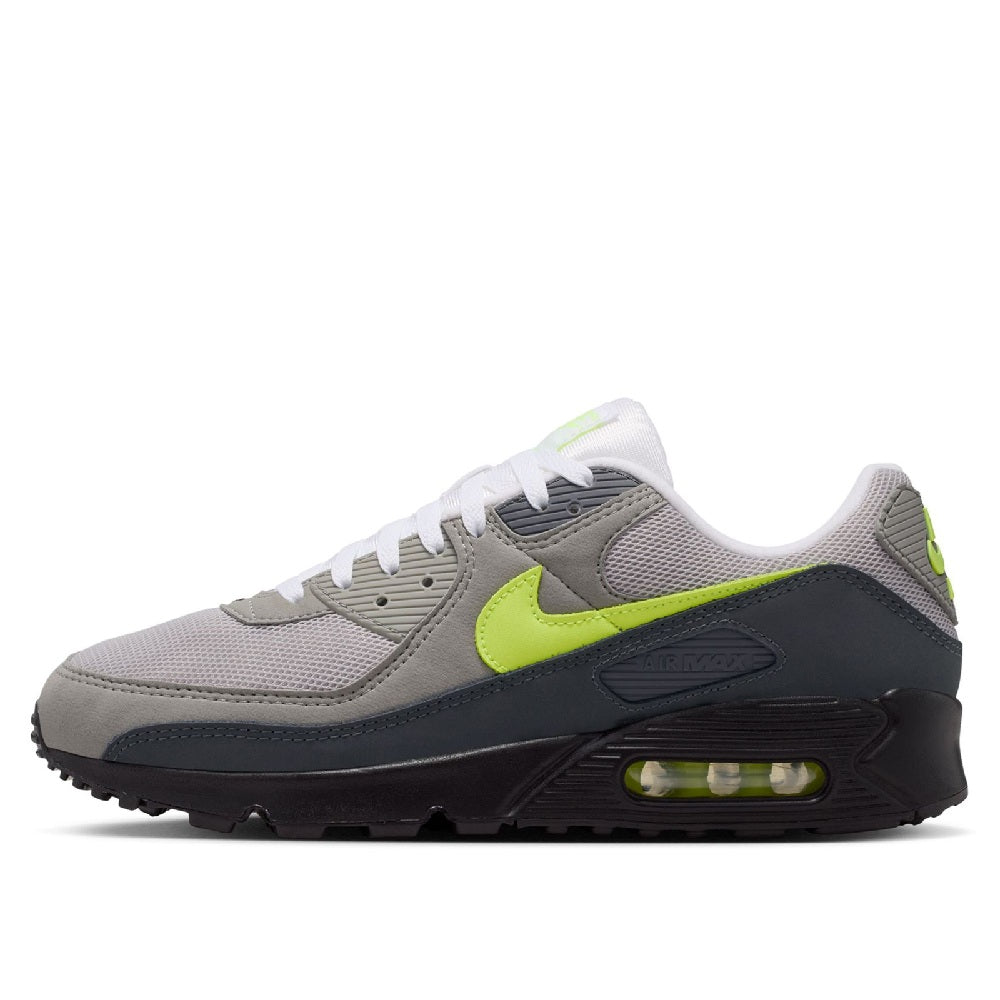 Low-top running sneaker with neon yellow swoosh and gray mesh upper