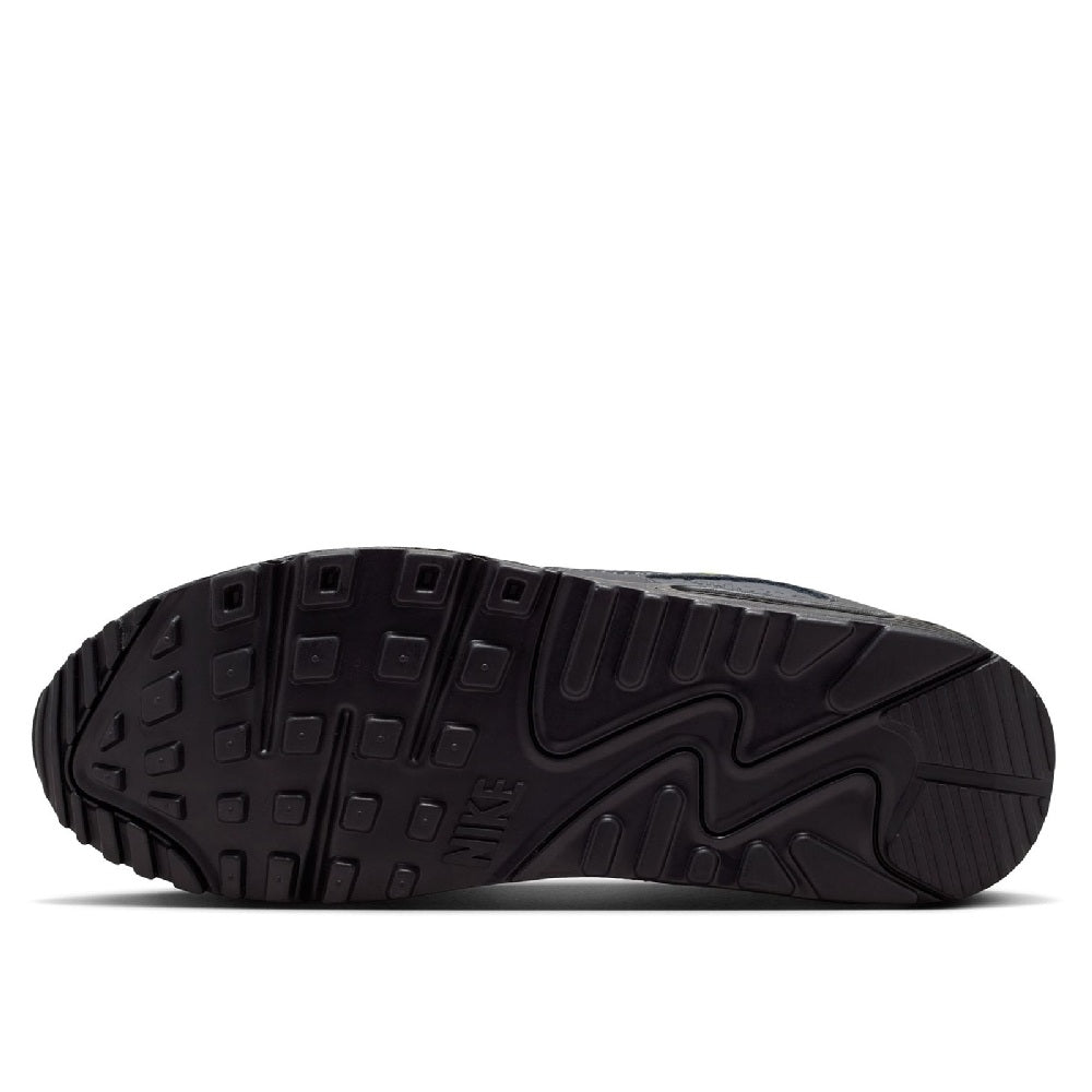 Outsole of gray and black Nike sneakers with textured tread for grip