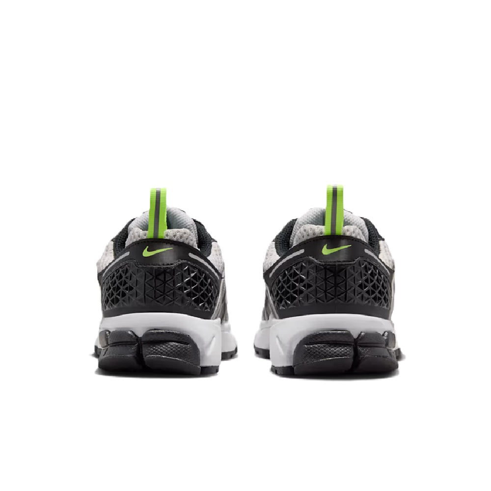 Big kid Nike Vomero 5 sneakers, rear view with black heel and neon green pull tab