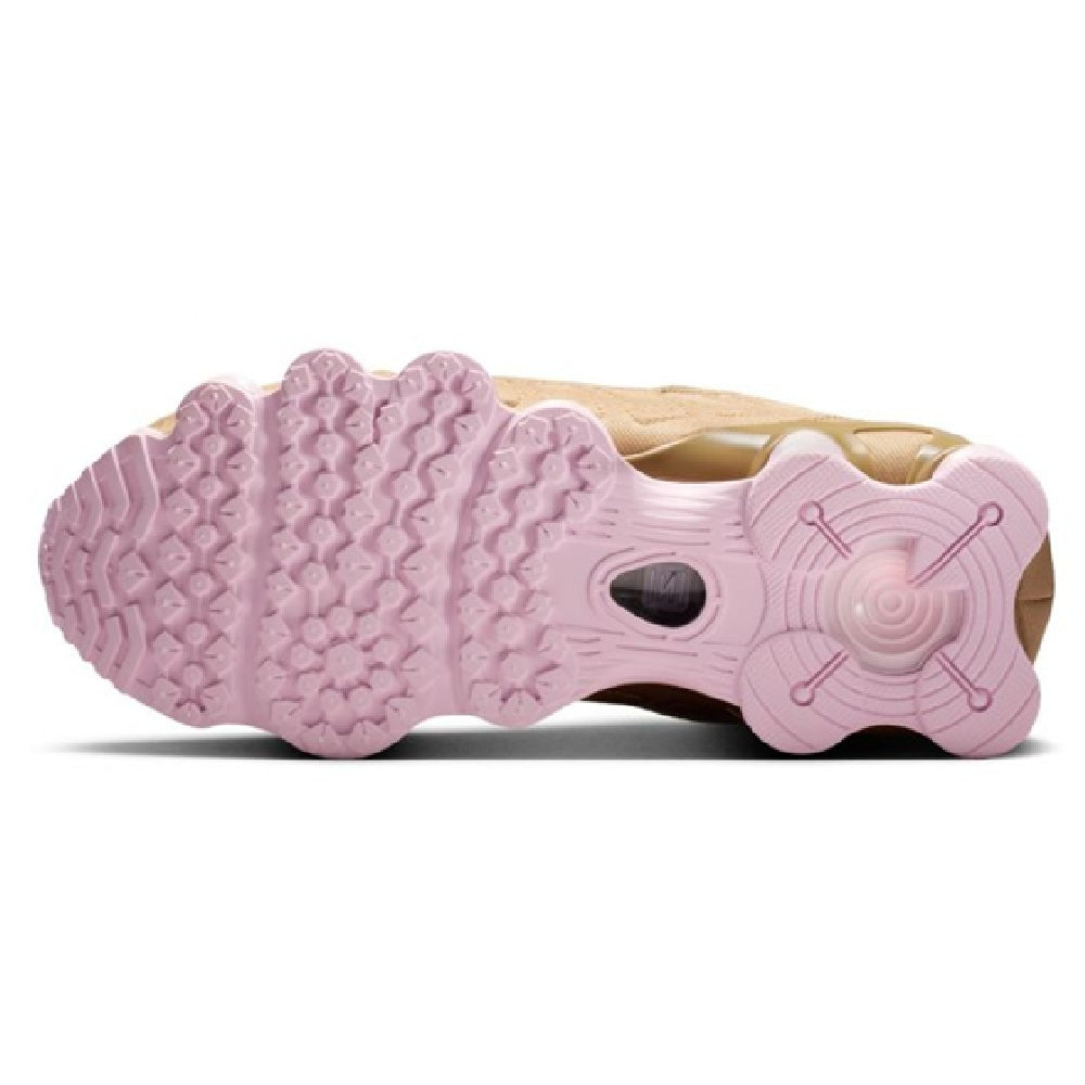 Nike Shox TL womens sneaker outsole, pink textured traction with tan forefoot