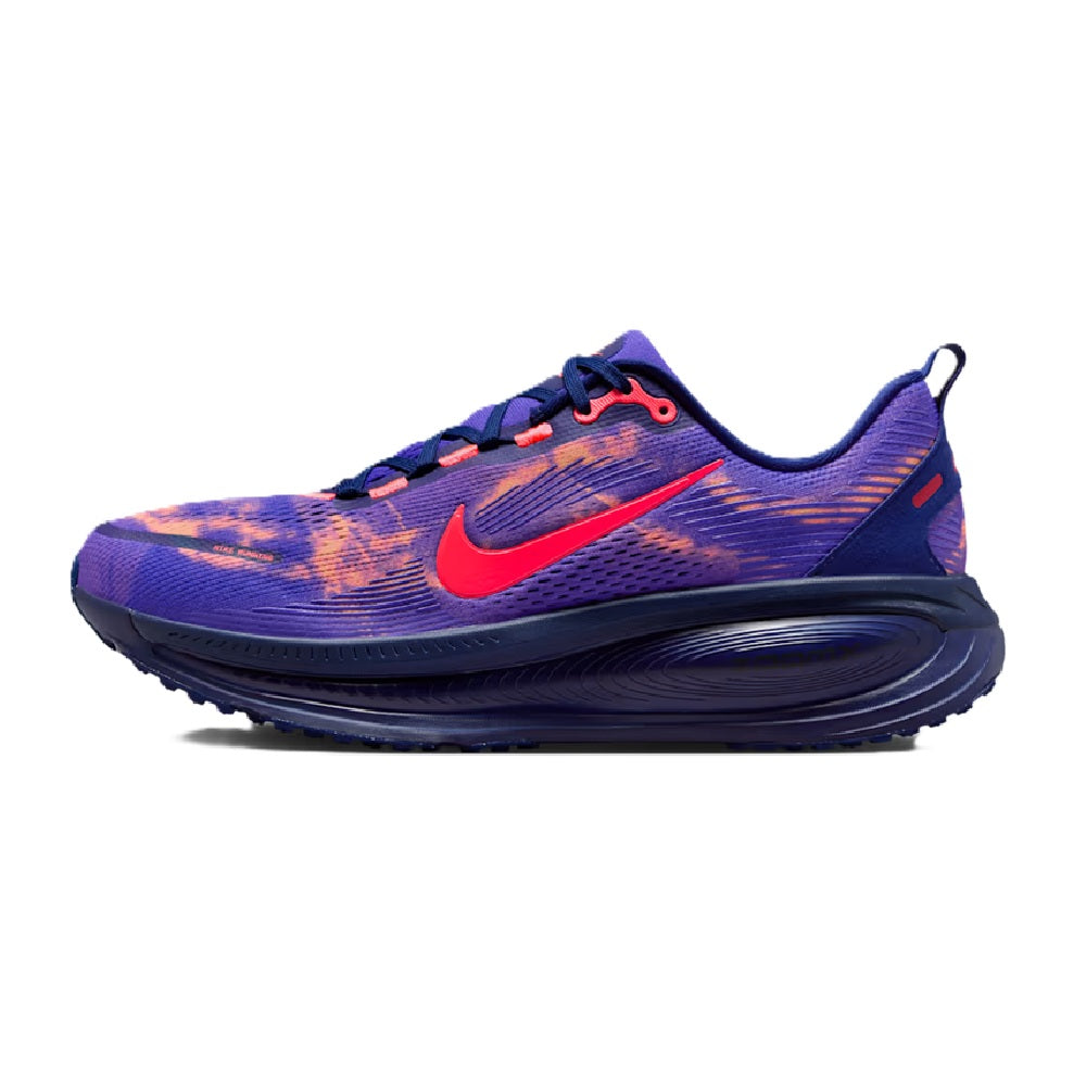 Purple and navy running sneaker with red Nike swoosh and lace-up