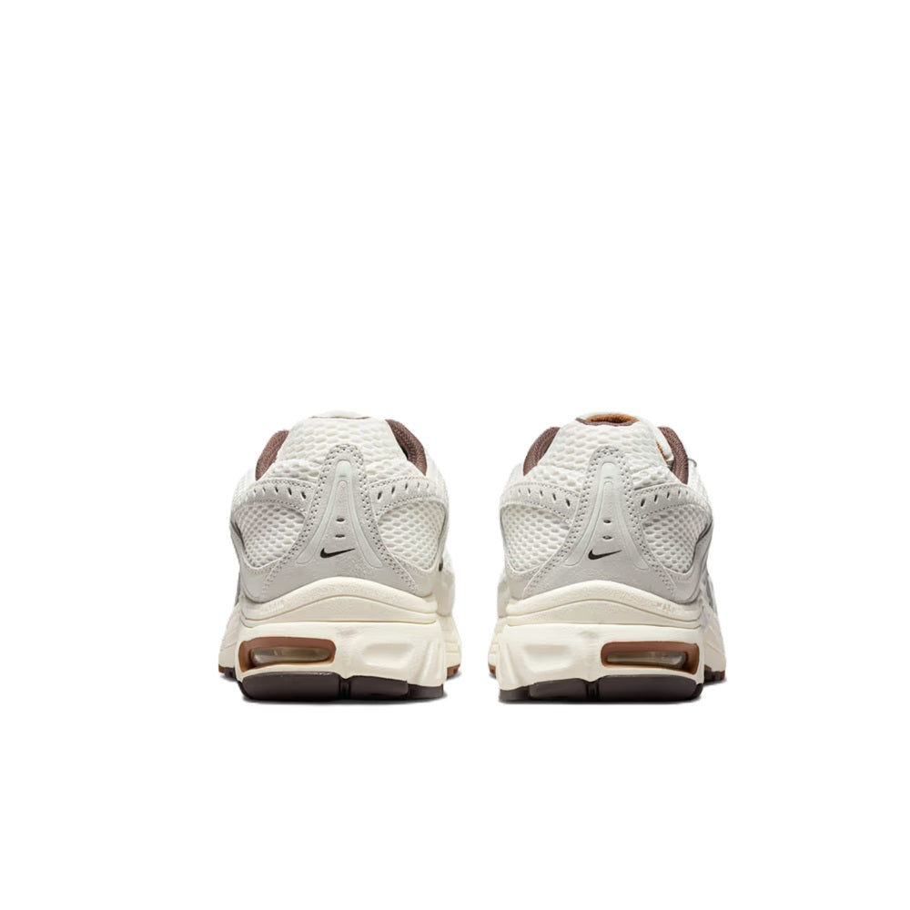 Men's Nike Air Max sneakers pair in white with brown heel and tan detailing, back view