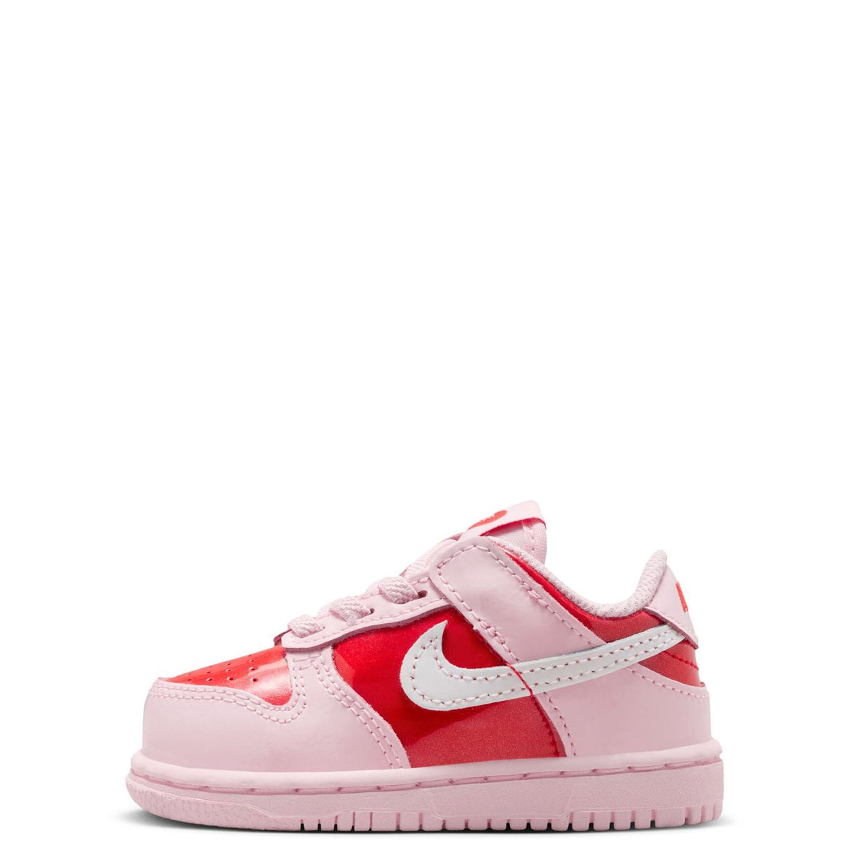 Toddler Nike Dunk Low sneakers in pink and white with red panels and white swoosh