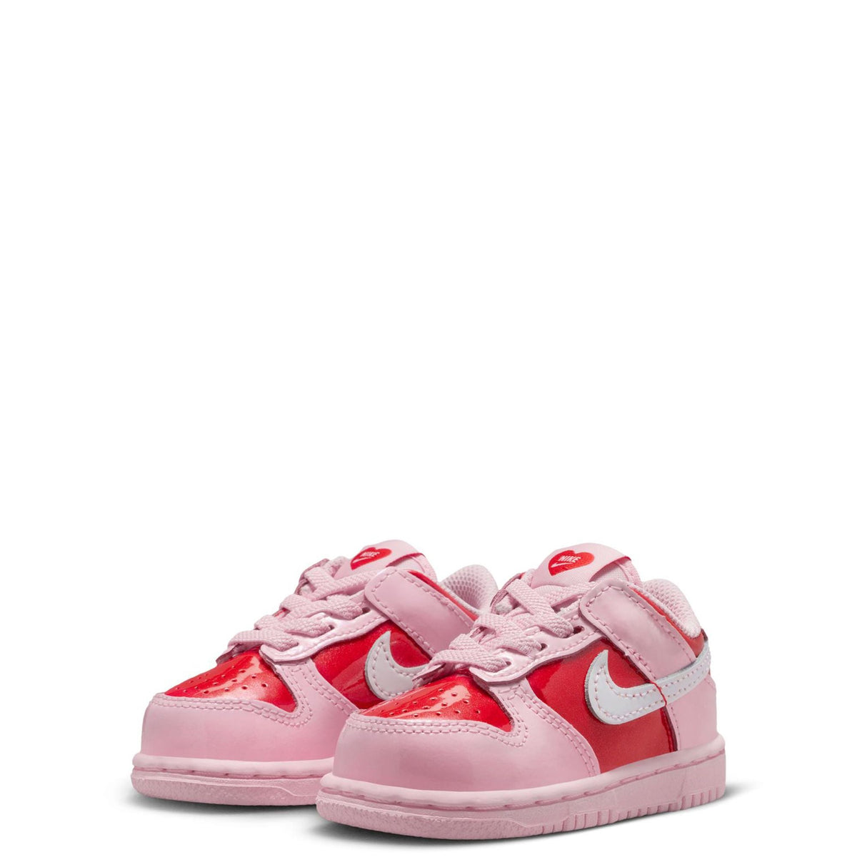 Pair of Toddler Nike Dunk Low sneakers, pink and red with white swoosh on side