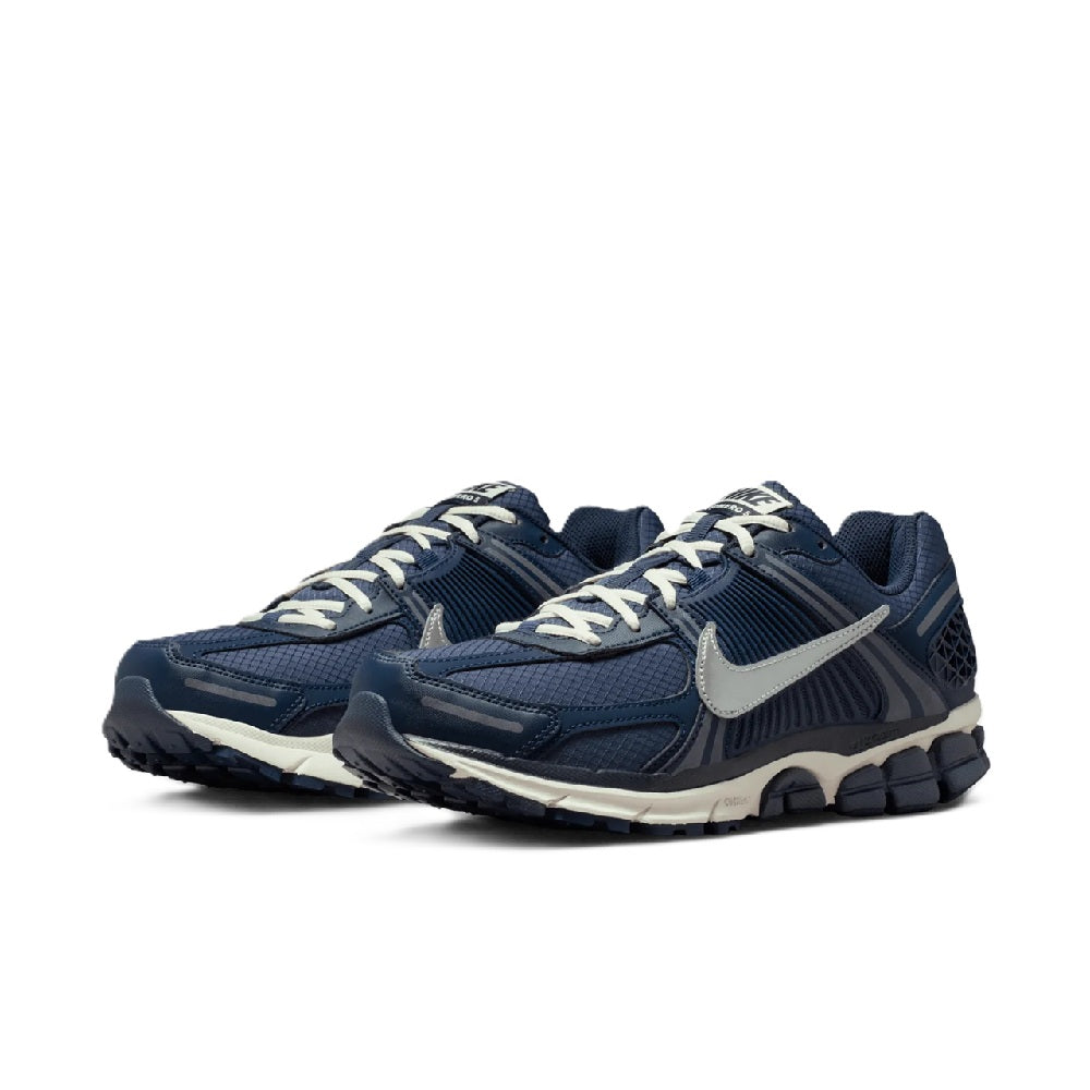 Men's Nike Zoom running shoe pair, blue upper with white laces and metallic silver accents