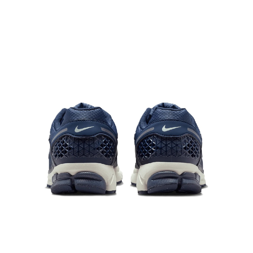 Men's Nike Zoom running shoe back view in blue with heel tab and white midsole