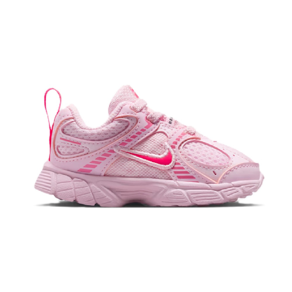 Toddler pink Nike sneakers with side Swoosh, mesh panels, and cushioned sole