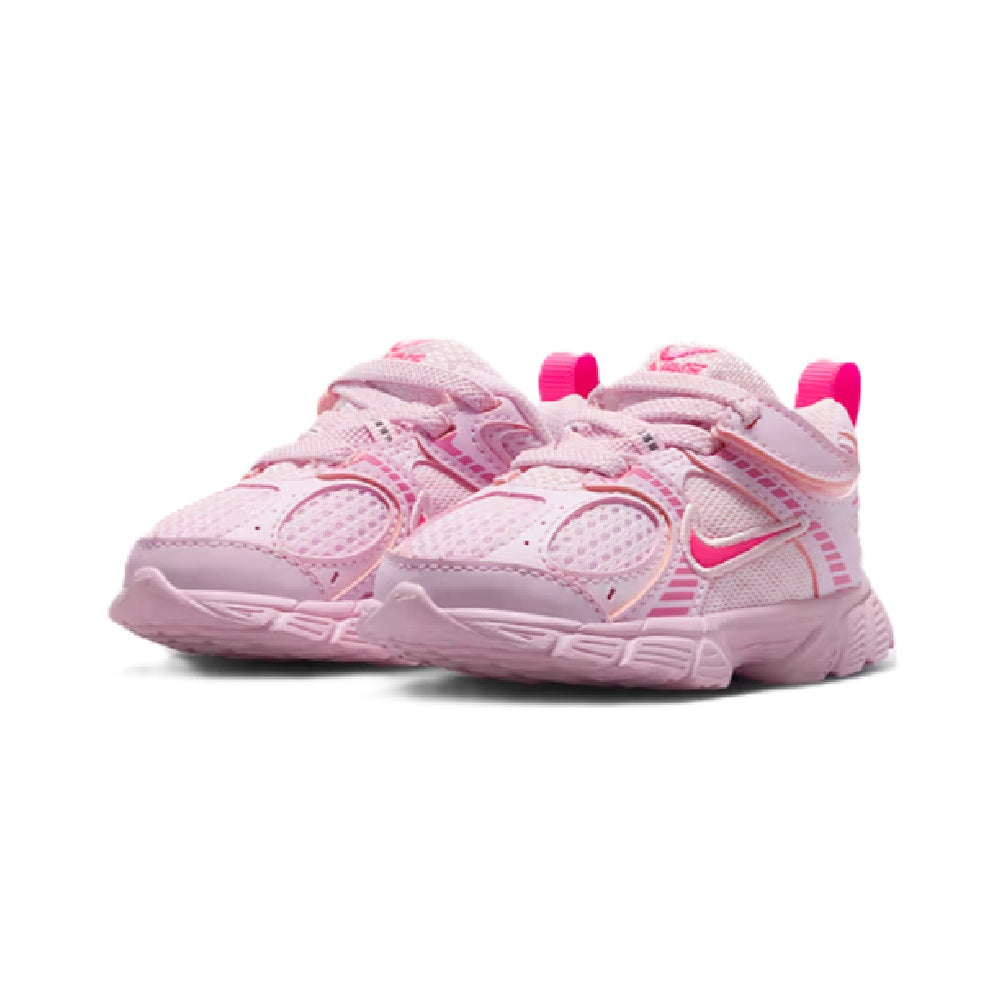 Toddler pink Nike sneakers pair, two hook-and-loop straps, padded collar