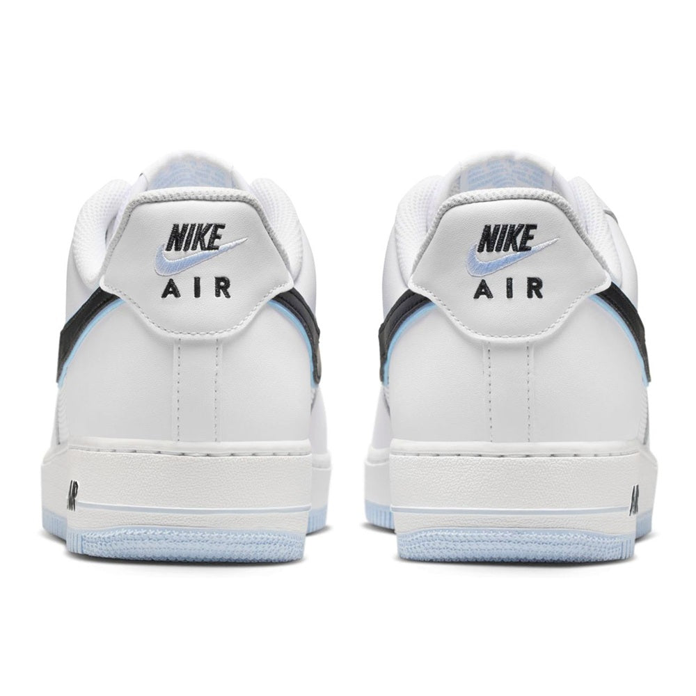 Nike Air Force 1 heel view, white upper with NIKE AIR branding and light blue outsole