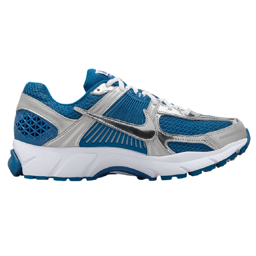 Nike Zoom Vomero 5 sneaker side view in blue mesh with silver and white accents