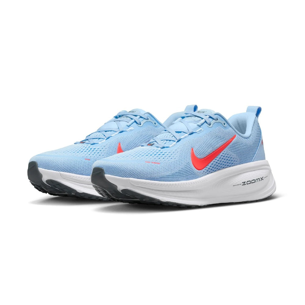 Pair of men's Nike running shoes, light blue mesh with red swoosh and white sole.