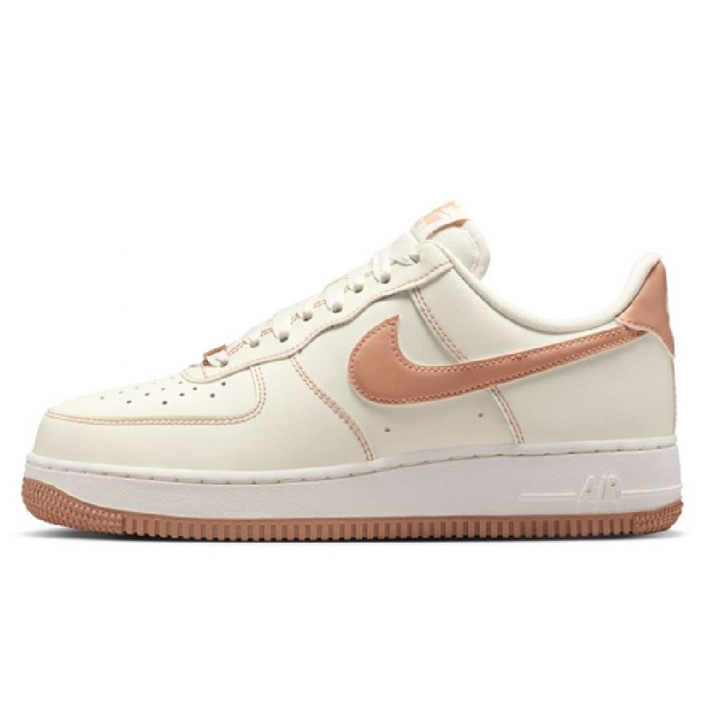 Nike Air Force 1 low-top sneakers in sail with rose gold Swoosh and gum sole
