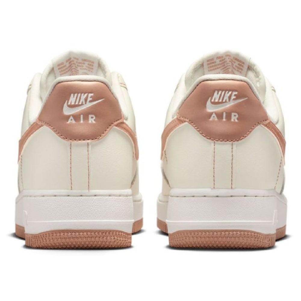 Nike Air Force 1 sneakers back view in sail with rose gold Air logo and gum sole