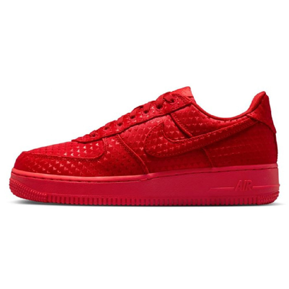 Red low-top sneakers with perforated leather-look upper, lace-up front, Nike Air sole