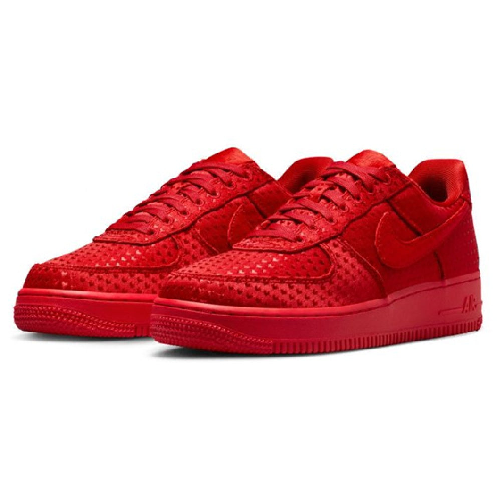 Pair of red low-top Nike Air Force 1 sneakers, lace-up with textured panels