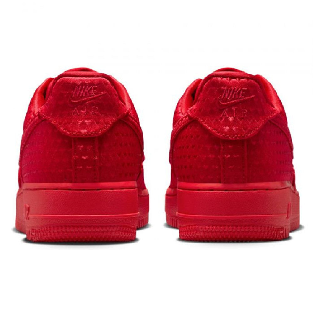 Red Nike low-top sneakers, rear view showing heel tabs and Air Force 1 branding