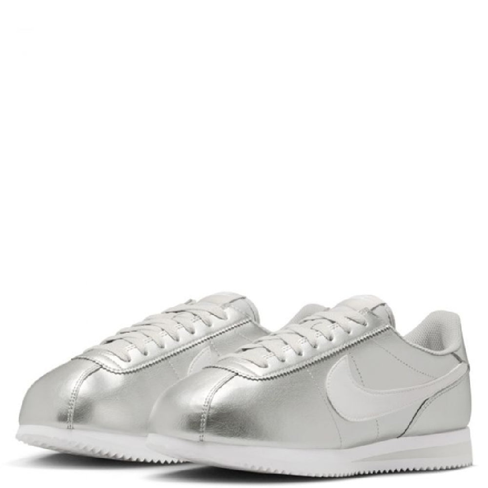 Pair of metallic silver Nike Cortez low-top sneakers with white laces.