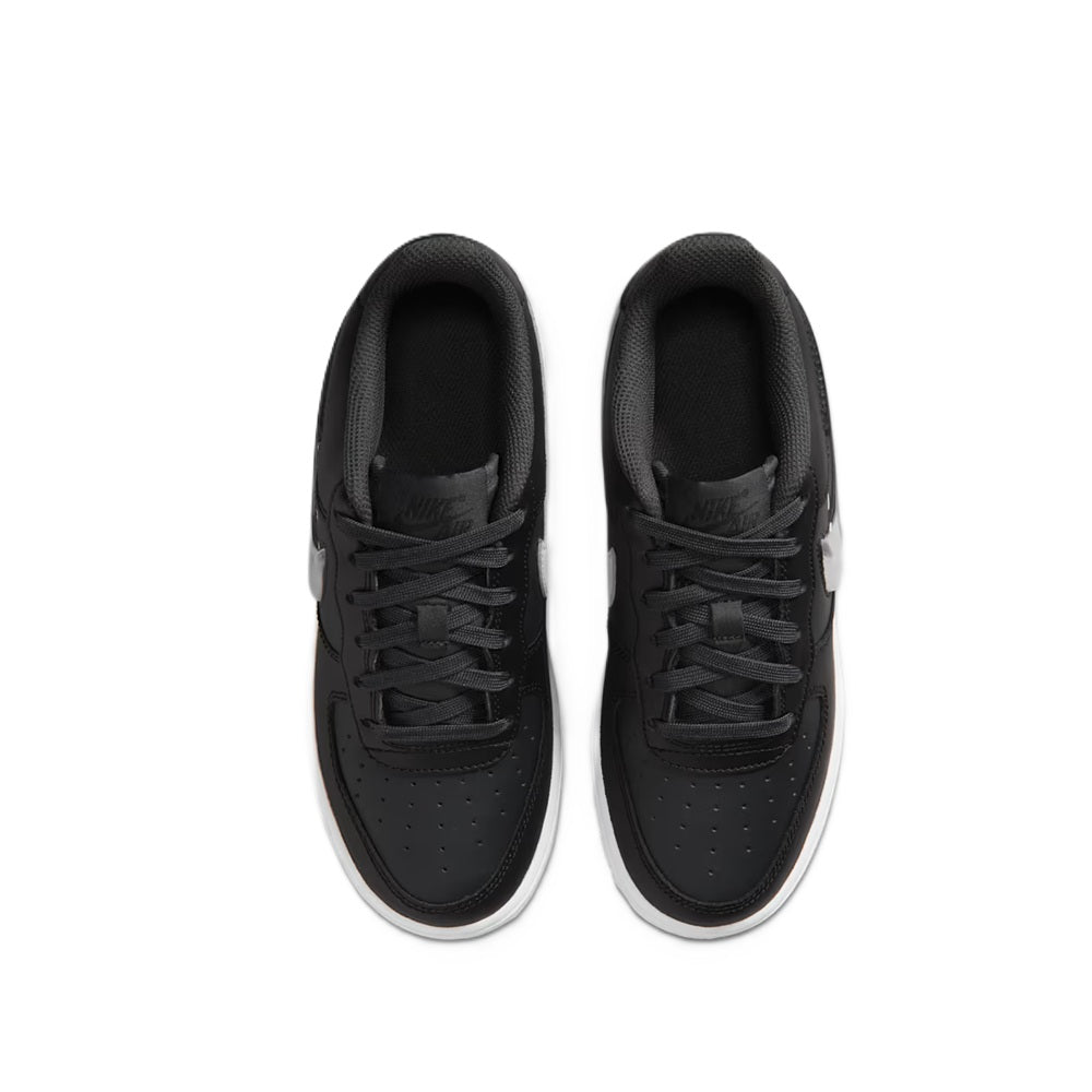 Nike Air Force 1 kids sneakers top view, black laces and perforated toe panels