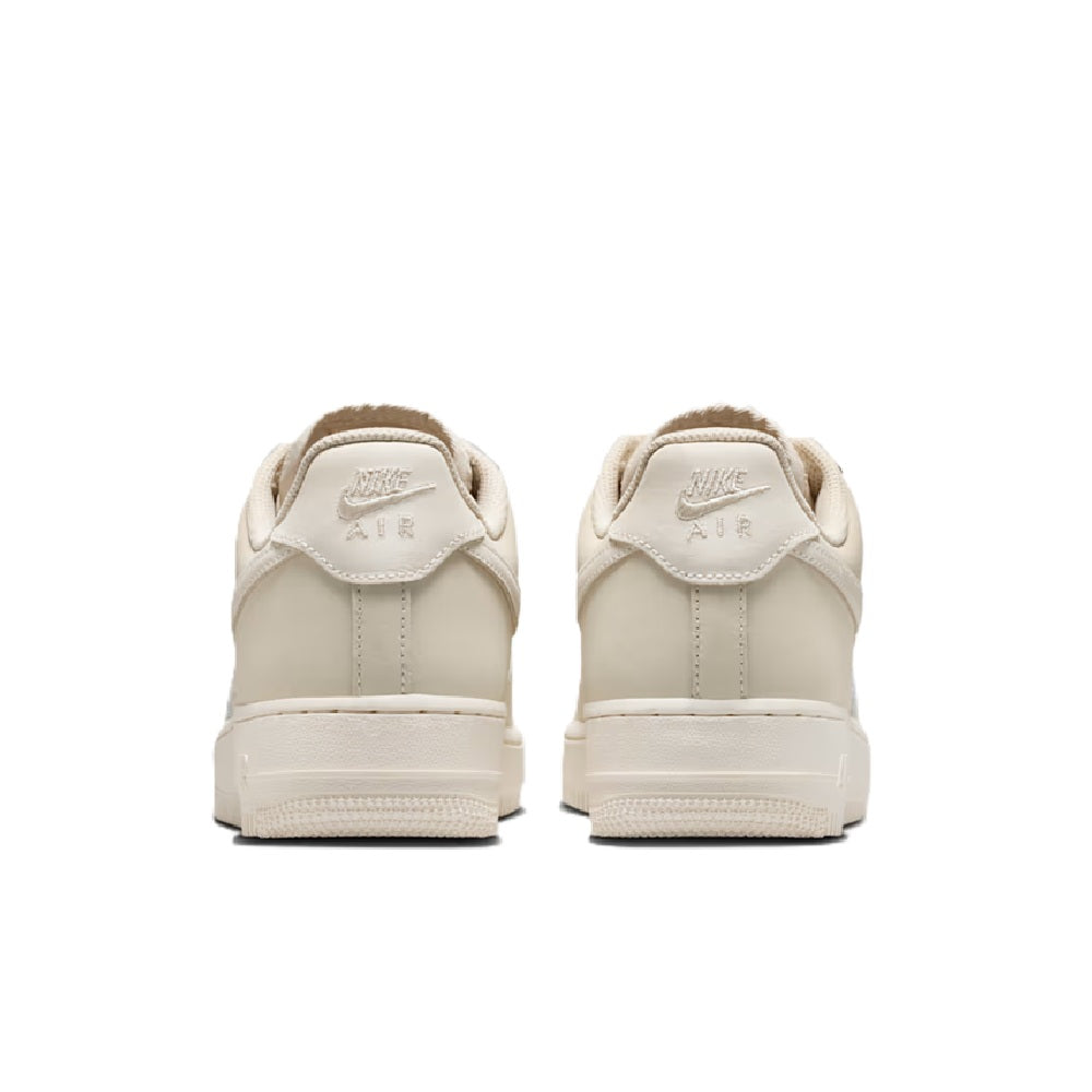 Nike Air Force 1 PRM sneakers in oatmeal and pale ivory, rear view with heel tab
