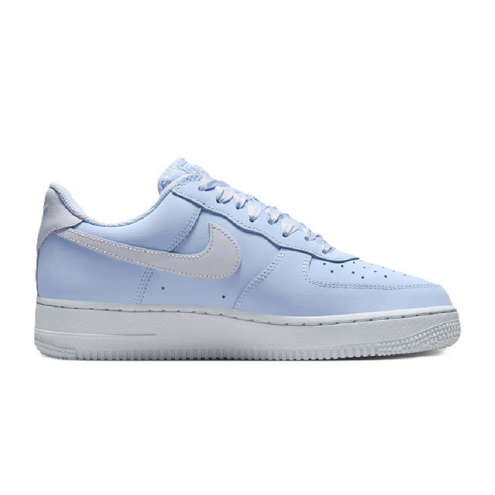Nike low-top sneakers in light blue with grey leather panels and lace-up design