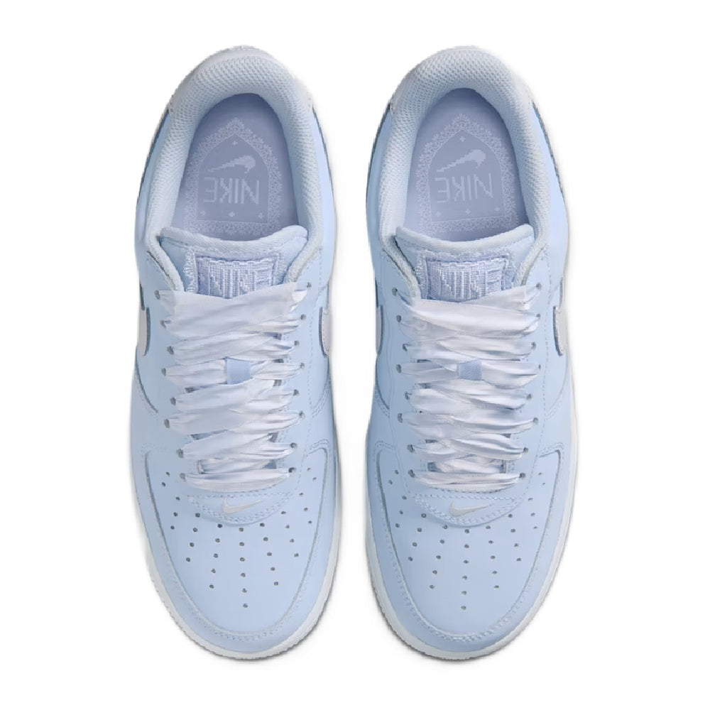 Nike lace-up sneakers in light blue with perforations and white laces, top view