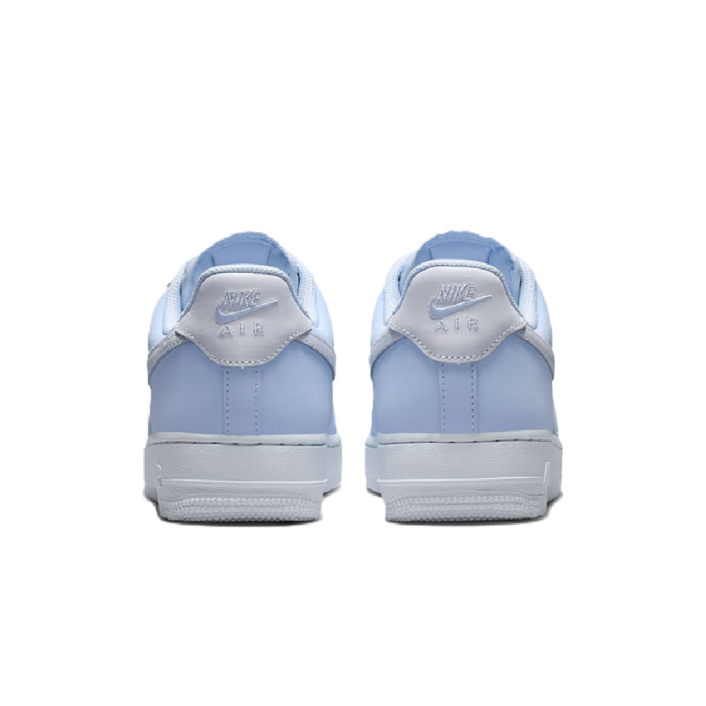 Nike low-top sneakers with light blue heel and toe panels, rear lace tab, and white outsole