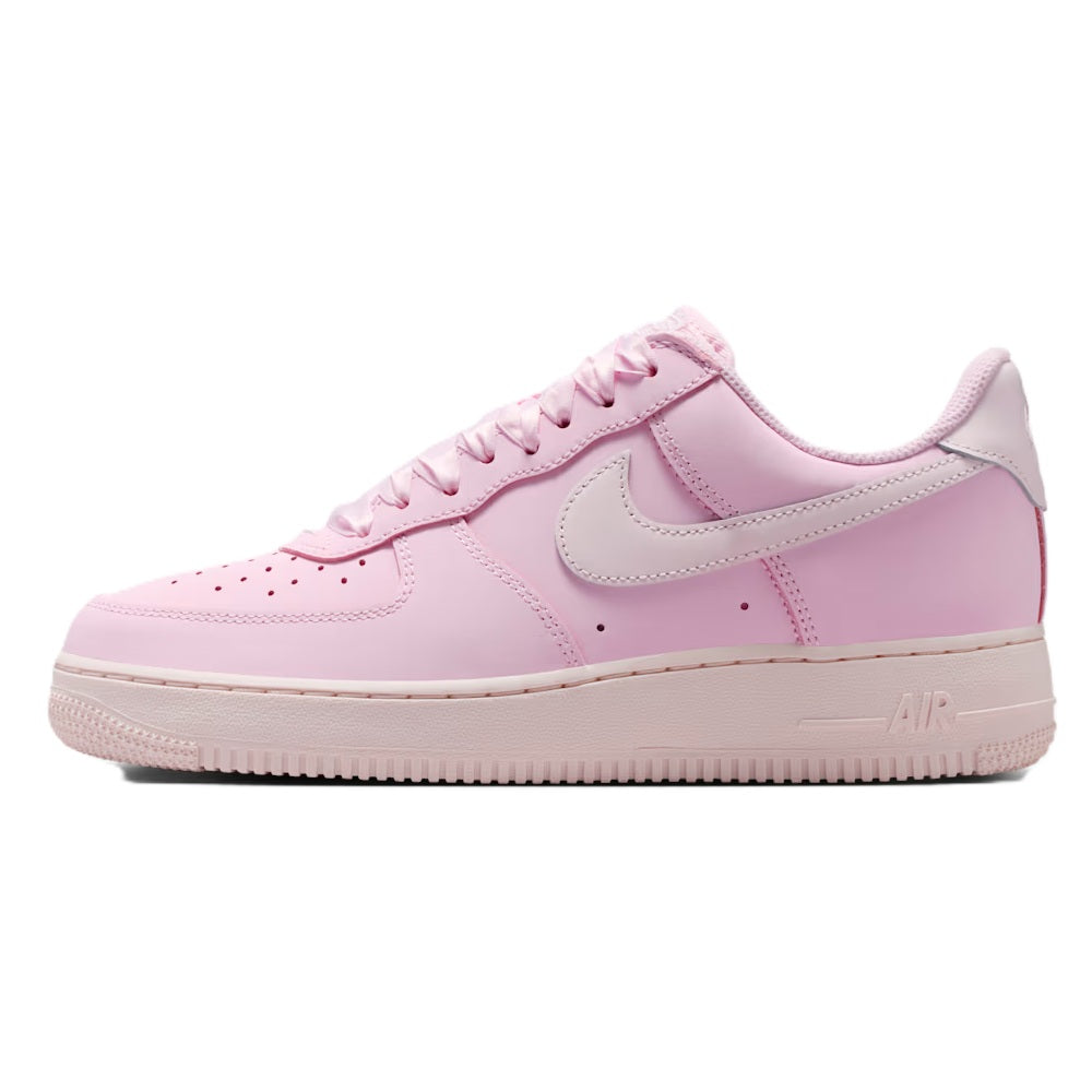 Pink low-top sneakers with Nike swoosh, lace-up closure, and Air branding