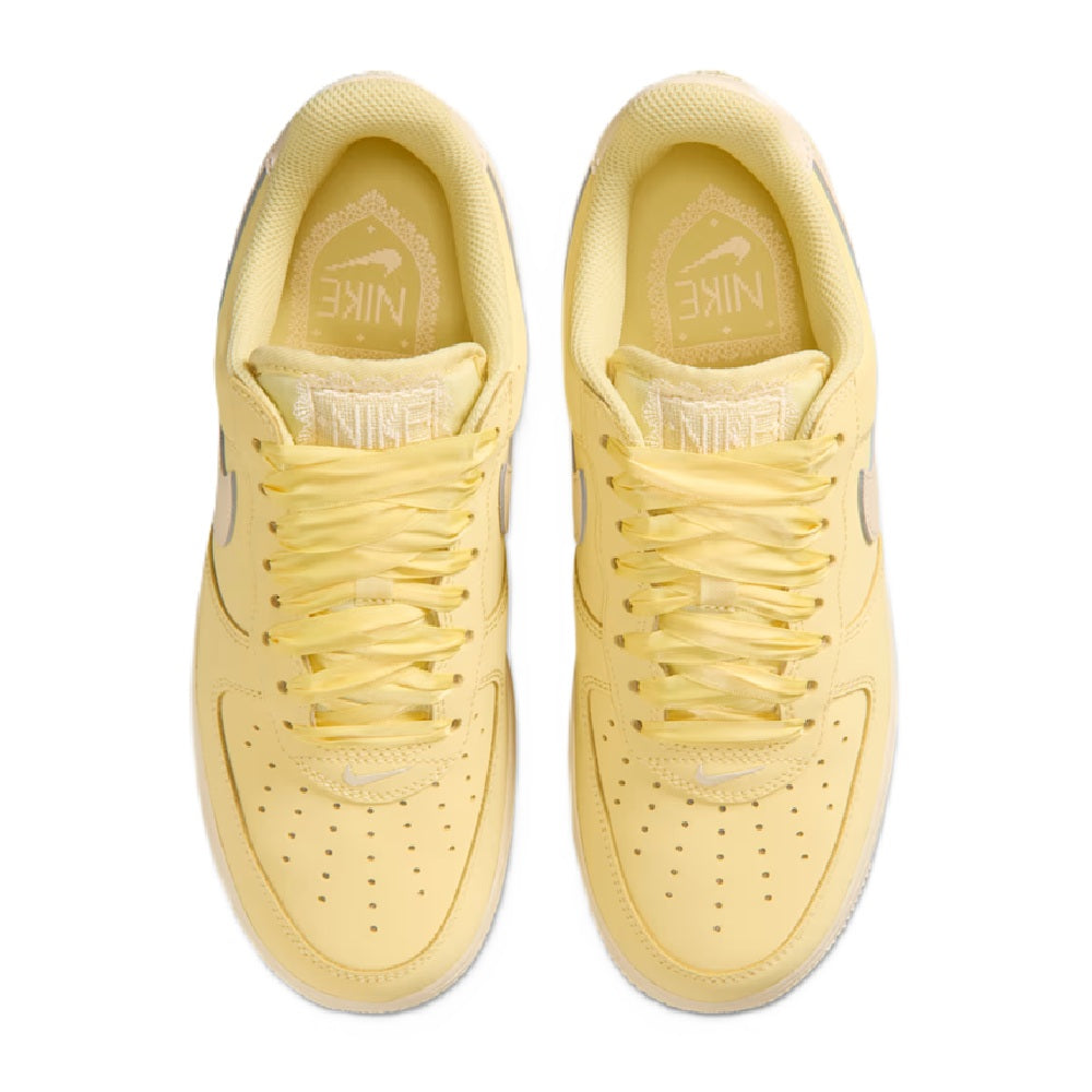 Women's Nike Air Force 1 PRM sneakers, two shoes front view with lace eyelets