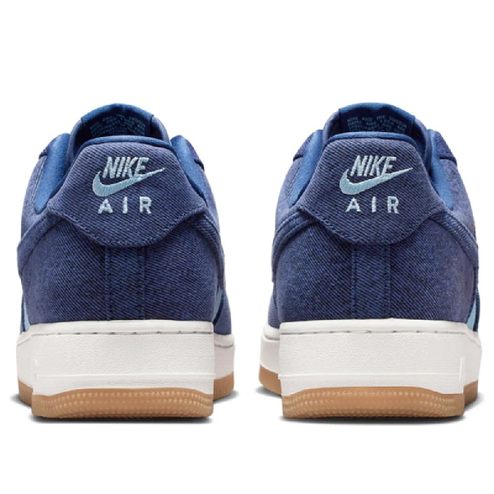 Back view of Nike Air Force 1 sneakers in navy fabric with white heel tab and gum sole
