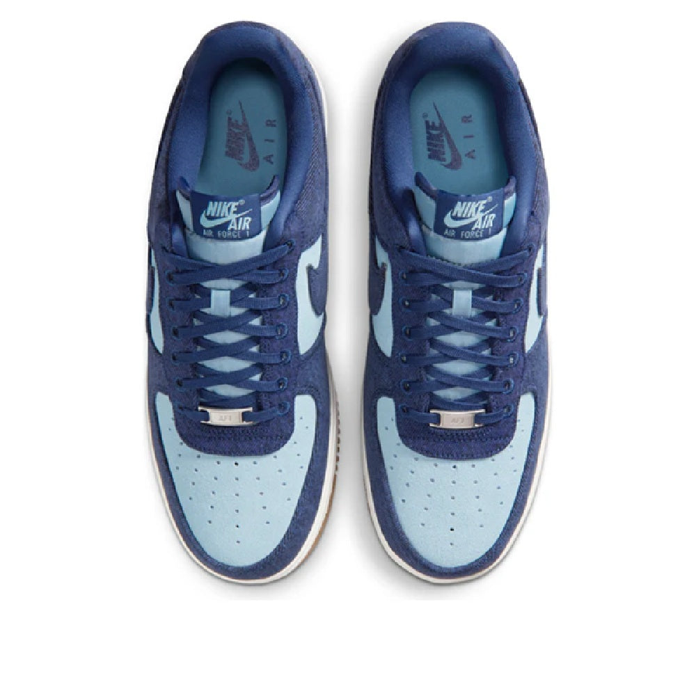 Top view of Nike Air Force 1 sneakers showing lace-up navy upper and light blue toe box