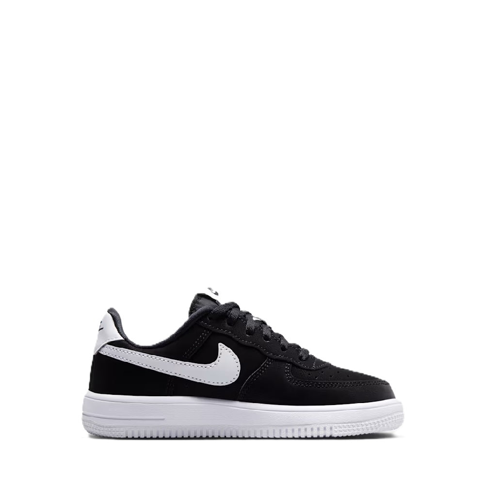 Black low-top kids sneakers with white Swoosh and lace-up front