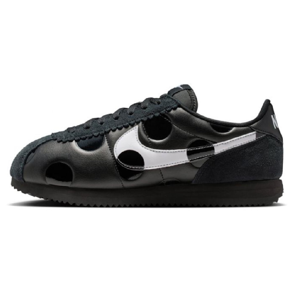 Women's Nike Cortez sneakers in black with white Swoosh and perforated toe
