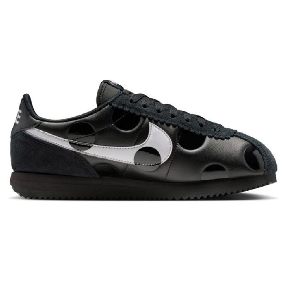 Women's Nike Cortez sneakers, black leather with white stripe and lace-up eyelets