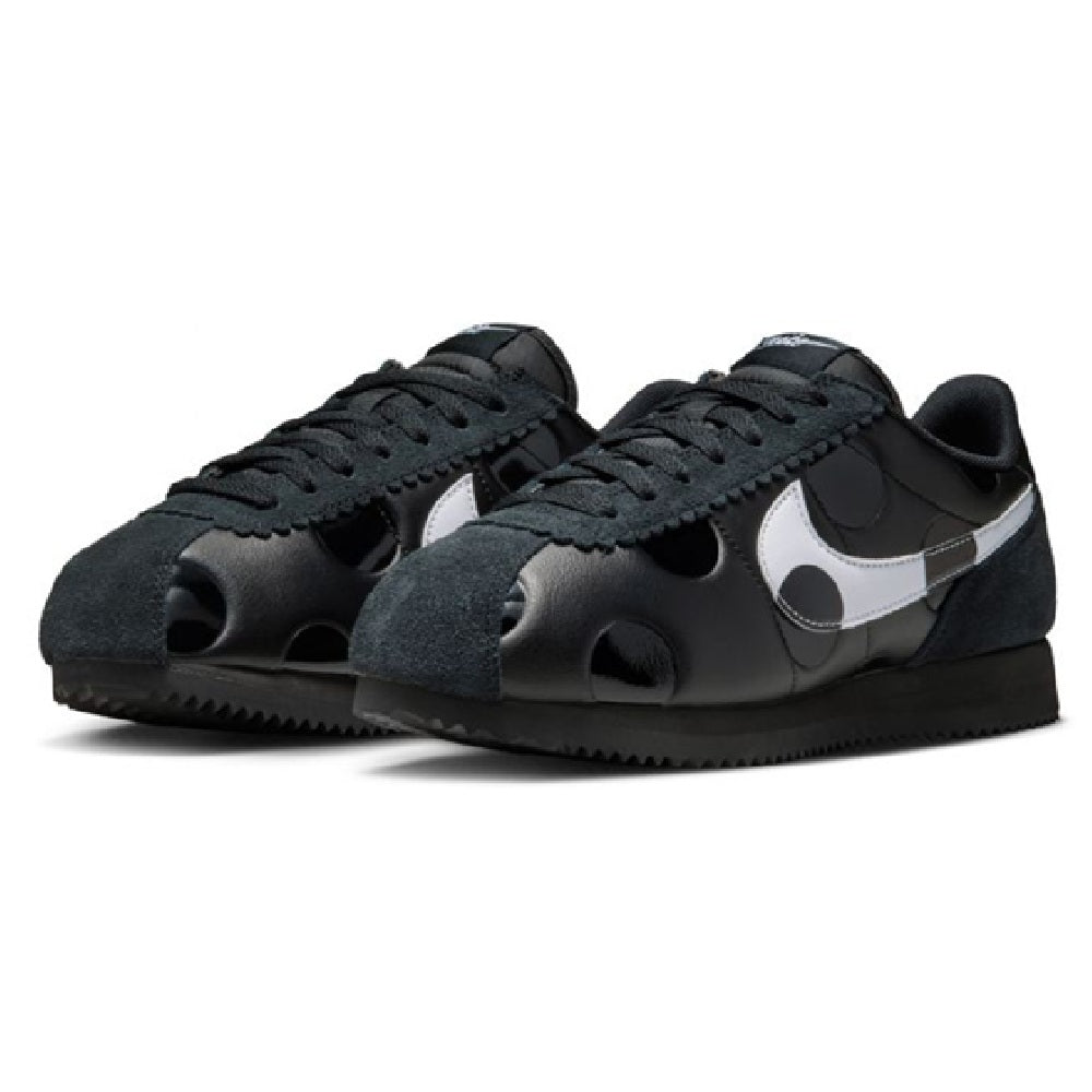 Women's Nike Cortez sneakers pair, black suede with white Swoosh and mesh cutouts