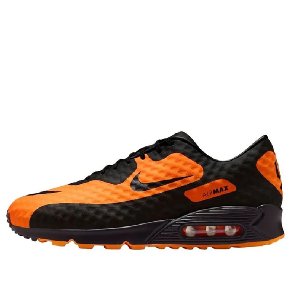 Nike Air Max 90 sneakers, black and bright orange with visible Air unit