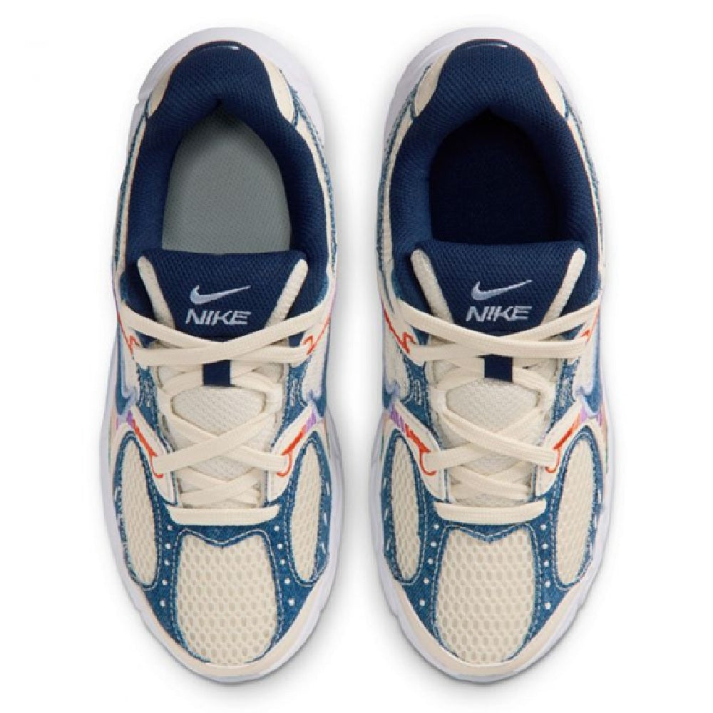 Kids' Nike sneakers with lace-up front, NIKE logo on tongue, and navy collar