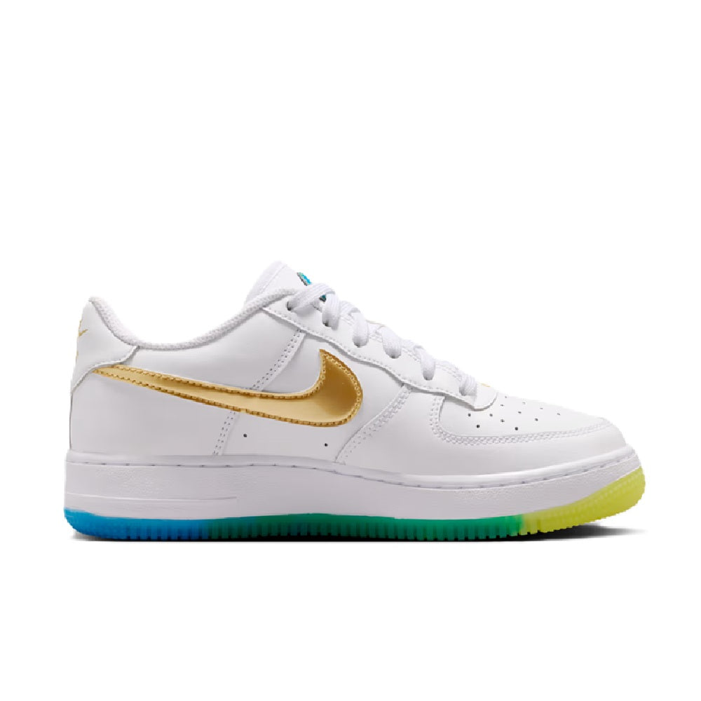 White low-top sneakers with gold Nike swoosh and blue-green outsole