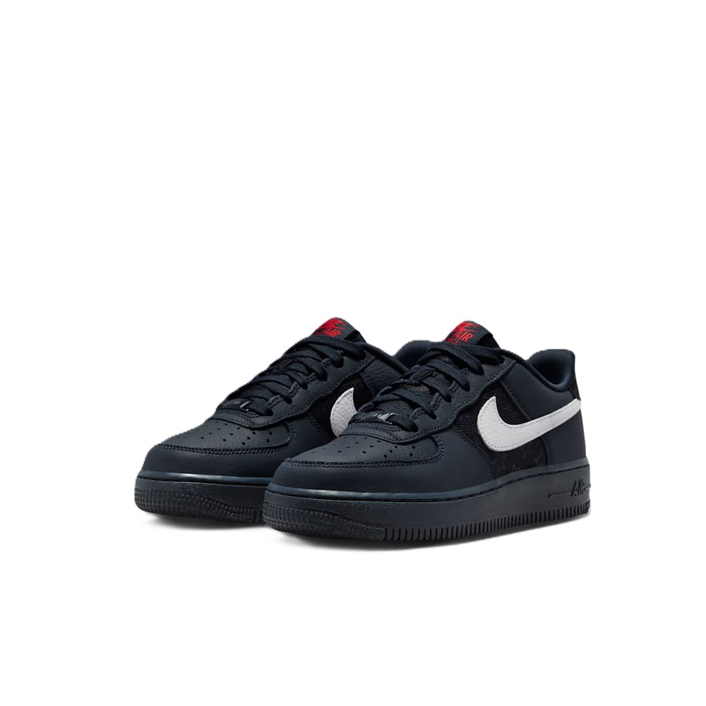 Pair of Nike Air Force 1 low sneakers in dark navy/black with white swoosh and red accents.