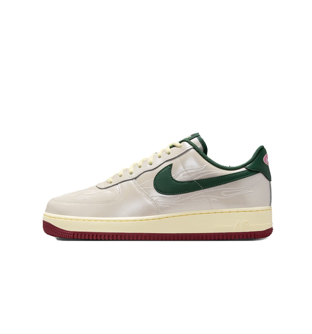 White leather low-top sneaker with green swoosh and burgundy rubber sole