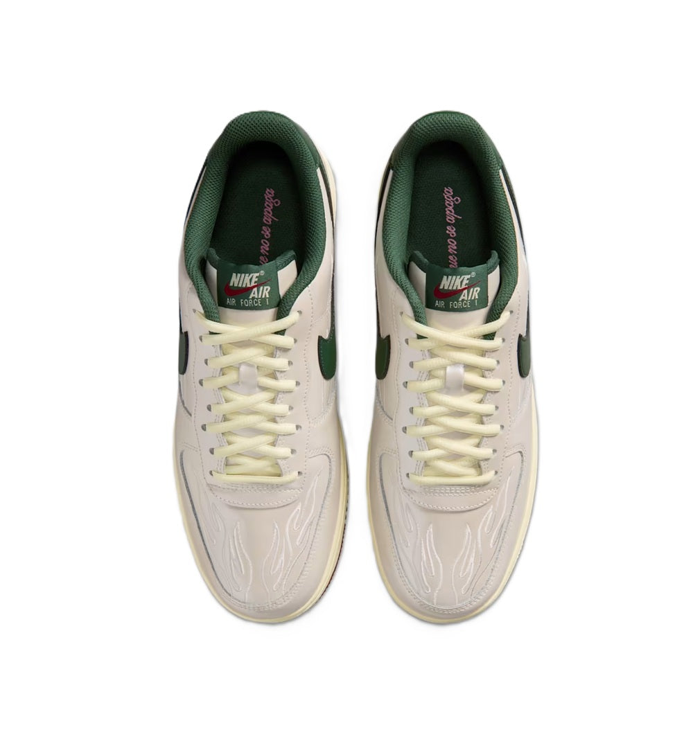 White low-top sneakers with green lining, cream laces, and “AIR” heel label