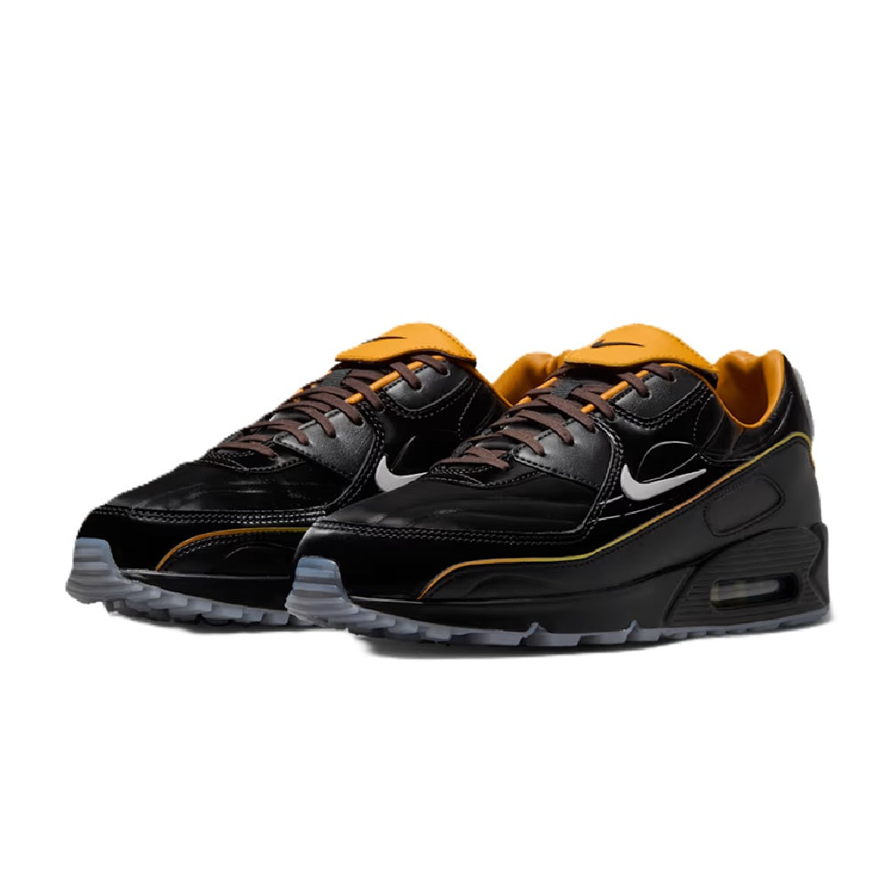 Nike Air Max 90 SE black sneakers with gold lining, brown laces, side swooshes