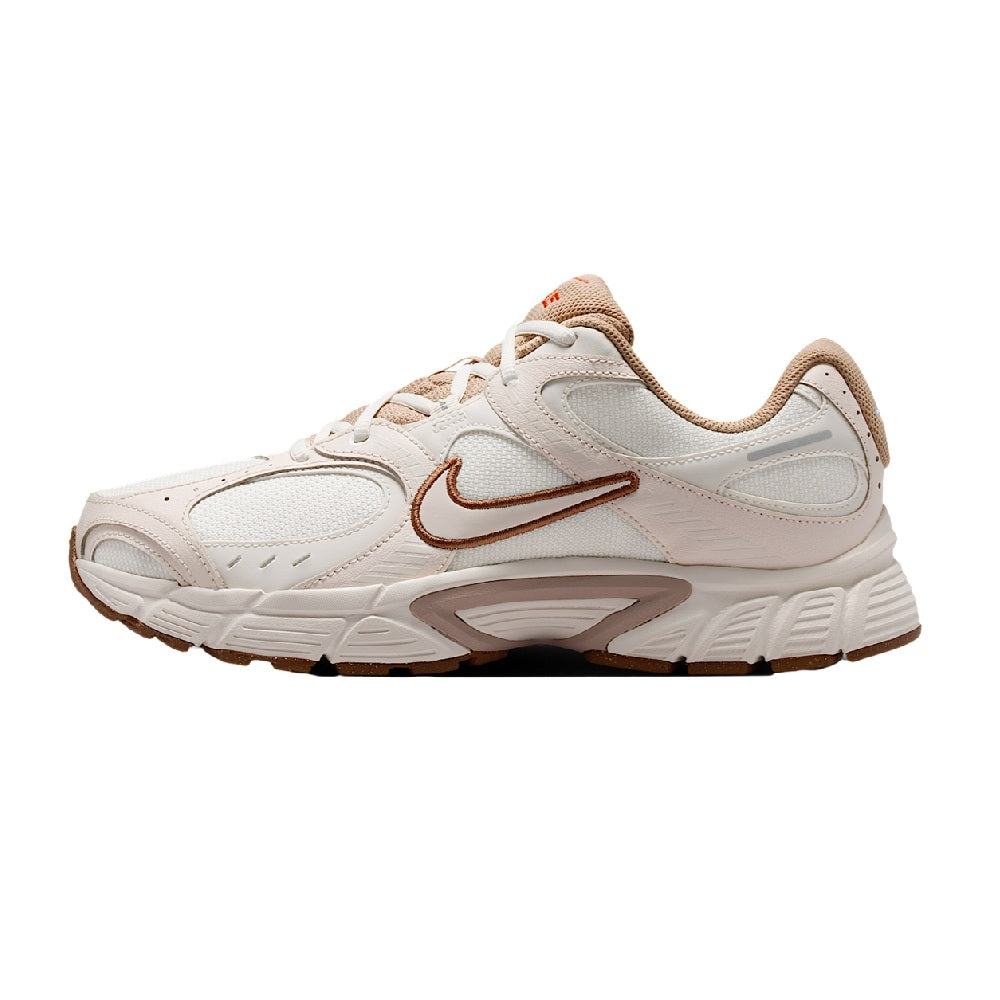 Men's Nike running sneaker in light ivory with tan accents, lace-up, side swoosh.