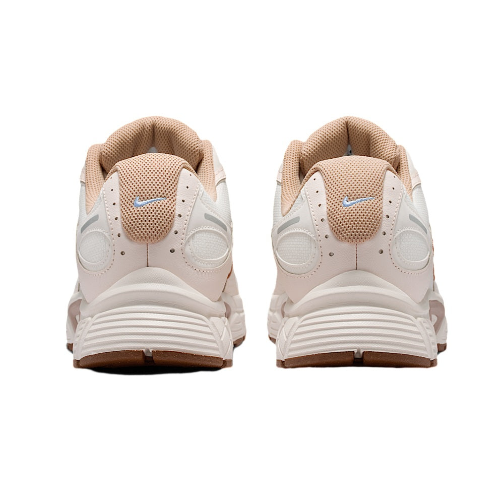 Men's Nike running sneaker, heel view, tan mesh collar with logo and cushioned sole.